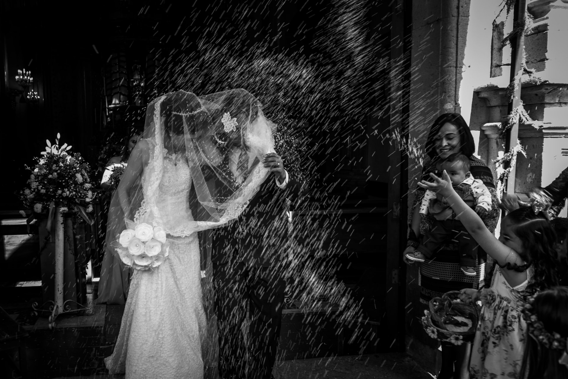 Rice thrown over the couple leaving the church